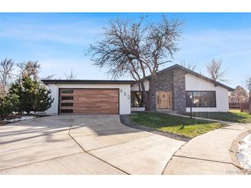 Stunning mid-century modern home with updated facade, new garage door and landscaping at 652 S Magnolia St, Denver, CO 80224