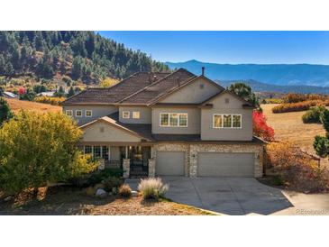 Two-story house with a large yard and mountain views at 4517 Tallyrand Cir, Castle Rock, CO 80104