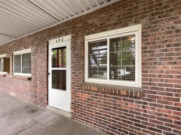 Exterior view of a brick building with a single entrance at 6800 E Tennessee Ave # 232, Denver, CO 80224