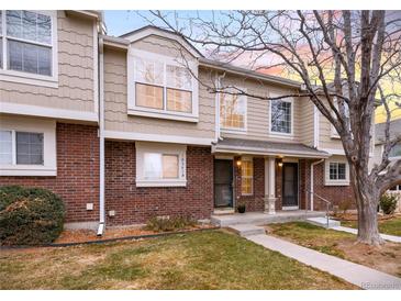 Attractive two-story townhome with a well-maintained lawn at 18397 E Alabama Pl # D, Aurora, CO 80017