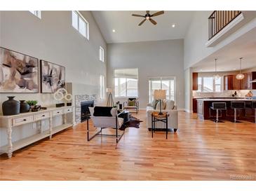 Open living room with hardwood floors and high ceilings at 958 Eldorado Ln, Louisville, CO 80027