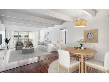 Spacious living and dining area with hardwood floors at 8060 E Girard Ave # 419, Denver, CO 80231