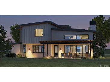 Modern home exterior with sleek design and outdoor dining area at 5292 Lions Paw St, Castle Rock, CO 80104