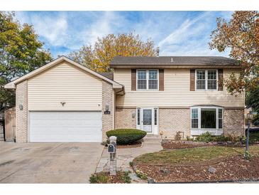 Two-story house with attached garage and landscaping at 1639 E 97Th Dr, Thornton, CO 80229