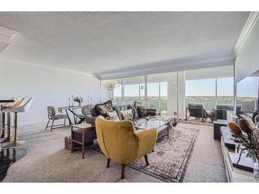 Spacious living room with floor to ceiling windows at 1155 N Ash St # 1504, Denver, CO 80220