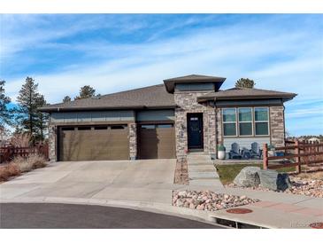 Ranch style home with stone accents and a 2-car garage at 7899 S Jackson Gap St, Aurora, CO 80016