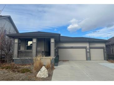 Two-story house with attached two-car garage and front porch at 4639 Clear Creek Dr, Longmont, CO 80504