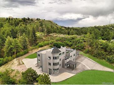 Castle-style home with expansive views and a large backyard at 5380 N Lariat Dr, Castle Rock, CO 80108