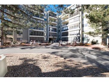 Attractive exterior of a multi-unit building with landscaping and ample parking at 13961 E Marina Dr # 106, Aurora, CO 80014