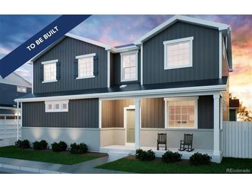 Two-story home with gray siding, rocking chairs on porch, and landscaping at , Aurora, CO 80019