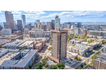 High-rise building aerial view, showing city skyline and pool at 100 Park Ave # 204, Denver, CO 80205