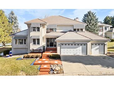 Two-story house with a large yard and two-car garage at 2504 S Fenton Ln, Lakewood, CO 80227