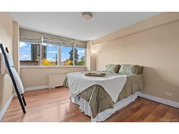 Bright bedroom with hardwood floors and large windows at 1196 N Grant St # 407, Denver, CO 80203