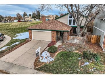 Cute ranch style home with a landscaped yard and attached garage at 2874 S Ursula Ct, Aurora, CO 80014