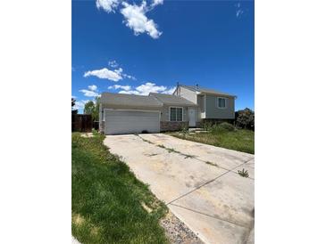 Ranch style home with attached two-car garage at 1415 S Pitkin Ct, Aurora, CO 80017