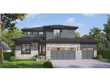 Modern two-story home with gray siding, stone accents, and a two-car garage at 882 Eldorado Dr, Superior, CO 80027