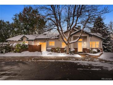 Exterior of charming townhome, showcasing snowy landscape and front entrance at 2951 S Walden Ct, Aurora, CO 80013