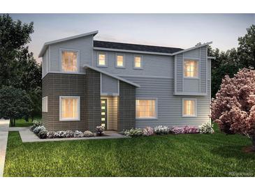 Two-story modern home with gray siding, dark brick accents, and landscaped lawn at 23930 E 41St Ave, Aurora, CO 80019