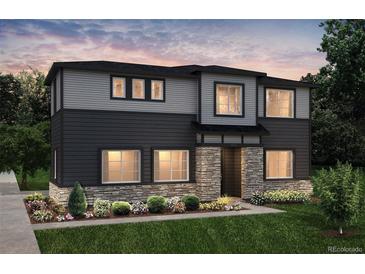 Two-story home with gray and dark siding, stone accents, and landscaping at 23931 E 40Th Ave, Aurora, CO 80019