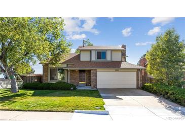 Two-story house with attached garage and lawn at 5895 S Killarney Way, Centennial, CO 80015