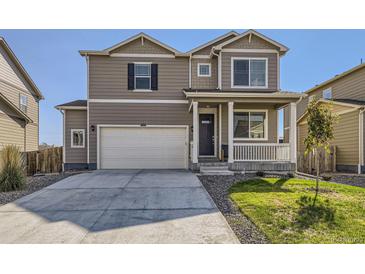 Two-story house with a two-car garage and front porch at 2412 Valley Sky St, Fort Lupton, CO 80621