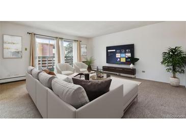 Living room with comfortable seating and smart TV at 495 S Dayton St # 10C, Denver, CO 80247