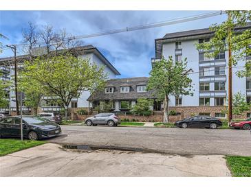 Modern condo building with ample parking and landscaping at 555 E 10Th Ave # 3, Denver, CO 80203