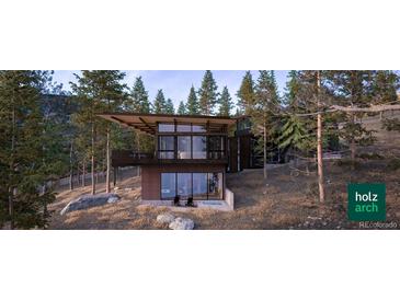 Modern home nestled in a wooded hillside setting at 7 Canyon Pines Dr, Arvada, CO 80403