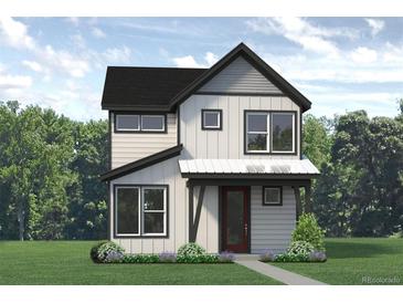 Two-story modern farmhouse with gray siding, dark roof, and red door at 2291 Serenidad St, Brighton, CO 80601