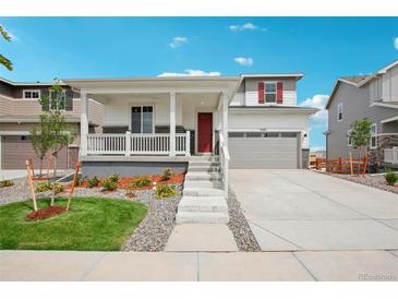 Two-story home with attached garage and landscaping at 3292 N Highlands Creek Pkwy, Aurora, CO 80019