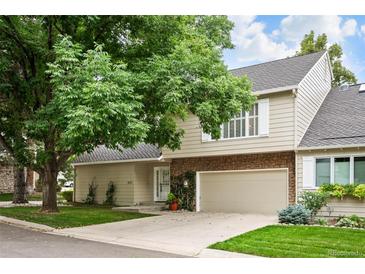 Two-story townhome with attached garage and landscaping at 4505 S Yosemite S St # 371, Denver, CO 80237