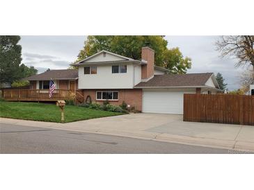 Brick ranch home with attached garage and deck at 8120 S Jay Dr, Littleton, CO 80128