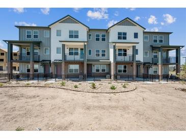 Modern townhome community with multiple units and balconies at 6940 Merseyside Ln, Castle Pines, CO 80108