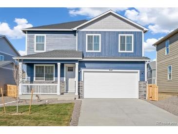 Stunning two-story home with a charming front porch at 14100 Black Sedge Cir, Parker, CO 80134