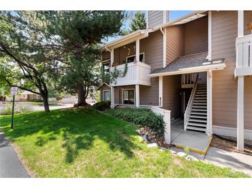 Exterior view of townhome with stairs and balcony at 4300 S Andes Way # 202, Aurora, CO 80015