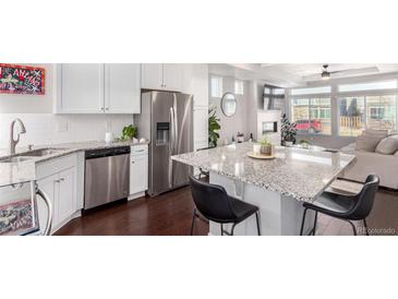 Modern kitchen with stainless steel appliances and granite countertops at 237 S Old Hammer St, Aurora, CO 80018