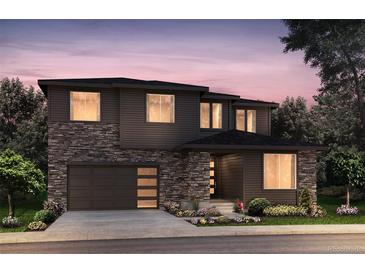 Two-story home with stone accents and a modern design at 8525 Silverton Ln, Littleton, CO 80125