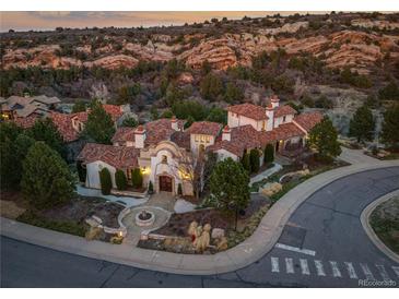 Luxury home with terracotta roof and expansive mountain views at 7944 Dante Dr, Littleton, CO 80125