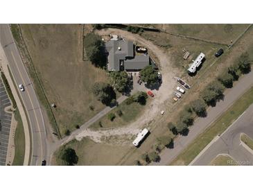 Aerial view of a house with large lot and RV parking at 6803 S Liverpool St, Centennial, CO 80016