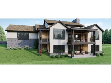 Luxury home with stone accents and patio at 6192 Oxford Peak Ln, Castle Rock, CO 80108