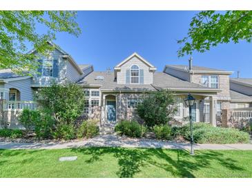 Two-story townhome with brick facade at 8016 E Fairmount Dr, Denver, CO 80230