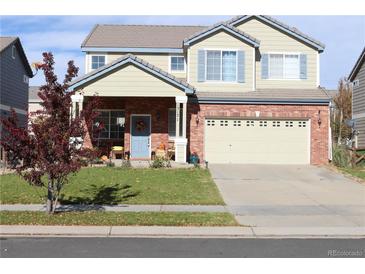 Two-story house with a brick and siding exterior at 15171 E 118Th Ave, Commerce City, CO 80603