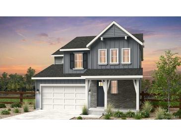 Two-story house with gray siding, white trim, and a two-car garage at 7267 Prairie Sage Pl, Littleton, CO 80125