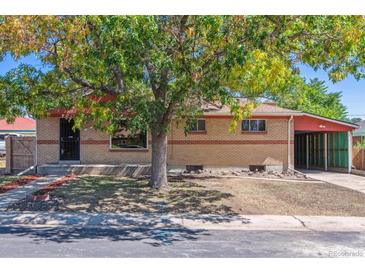 Brick ranch home with carport and mature landscaping at 7886 Cyd Dr, Denver, CO 80221