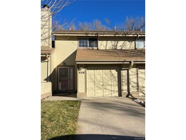 Charming two-story home with attached garage and inviting front entrance at 4218 Owens St, Wheat Ridge, CO 80033