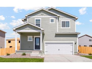 Two-story home with grey siding and a two-car garage at 7238 Arkansas St, Frederick, CO 80530