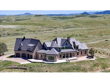 Luxury estate home with expansive grounds and mountain views at 7755 Moore Rd, Littleton, CO 80125