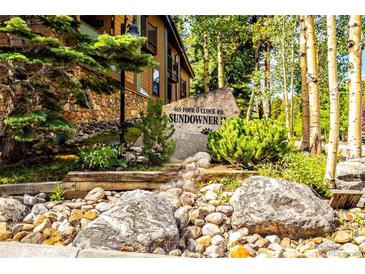 Attractive exterior of mountain condo building with stone accents and landscaping at 465 Four Oclock Rd # 323, Breckenridge, CO 80424