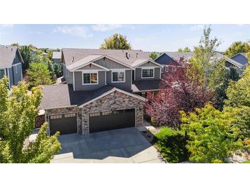 Charming two-story home with a three-car garage and landscaped front yard at 1824 Alpine Dr, Erie, CO 80516