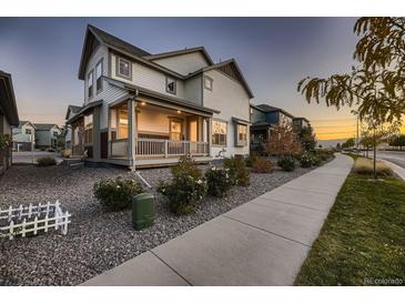 Two story house exterior with front porch and landscaping at 9307 Inca Dove Cir, Littleton, CO 80125